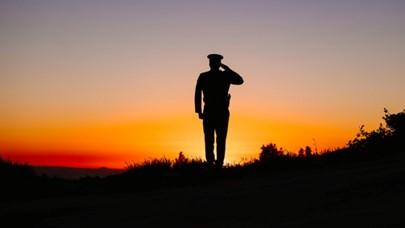 Shadow of soldier saluting